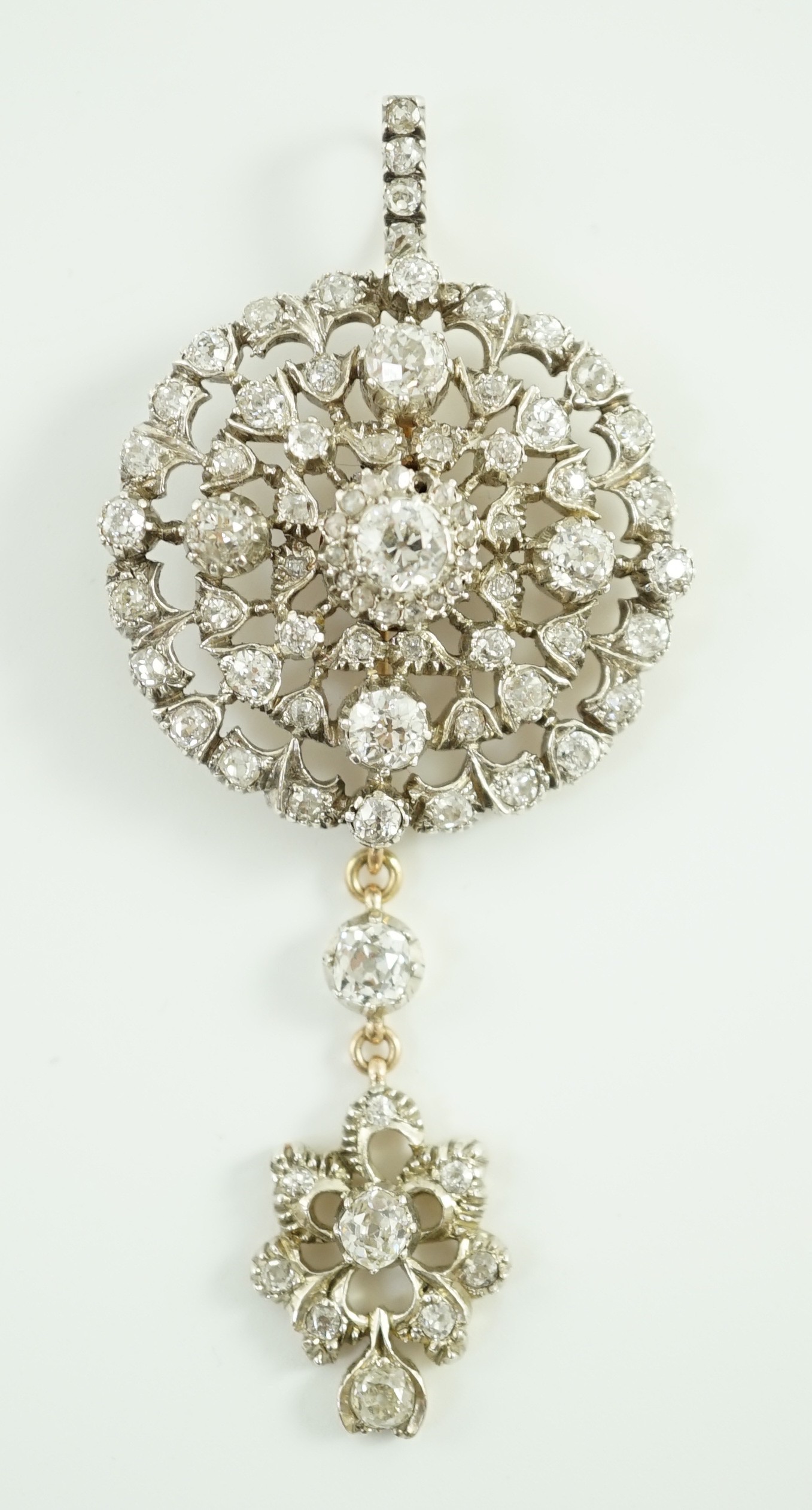 A Victorian gold, silver and graduated diamond cluster set target drop pendant brooch, retailed by Carlo & Arthur Giuliano